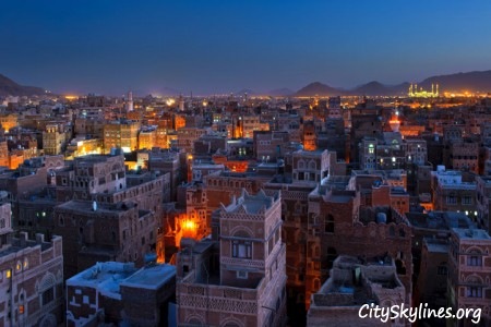 Sana’a City at Night, Building Top View with Mountain Backdrop